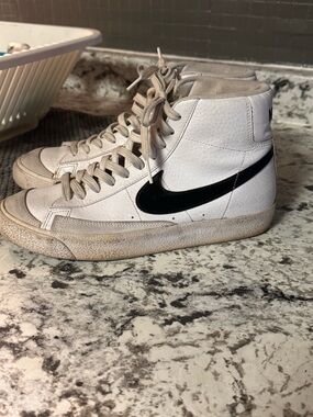Nike White High-Top Sneakers with Black Swoosh